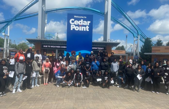  A large group of Henry Ford High School students and chaperones pose for a group photo 